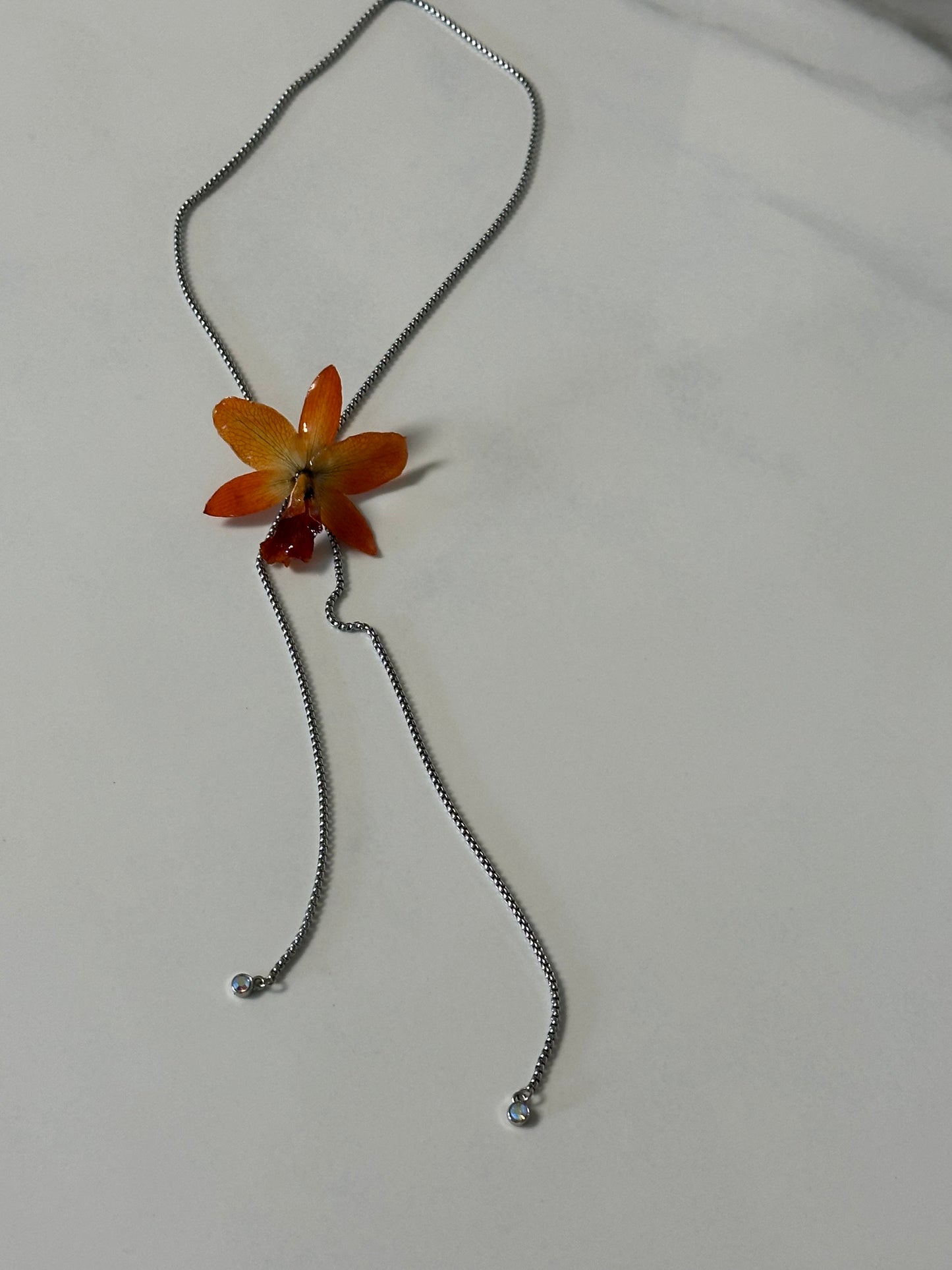 Adjustable orange orchid necklace
