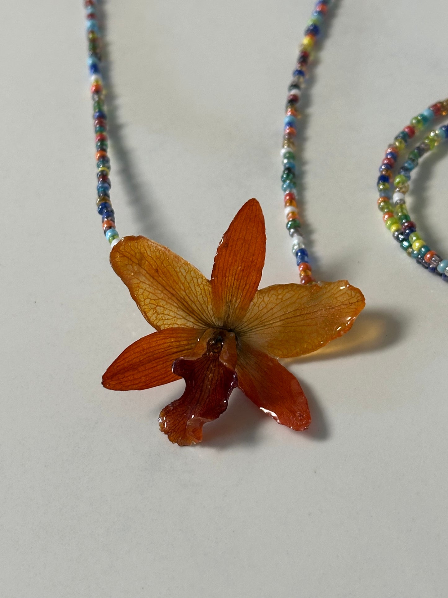orange  cattleya necklace with bracelet