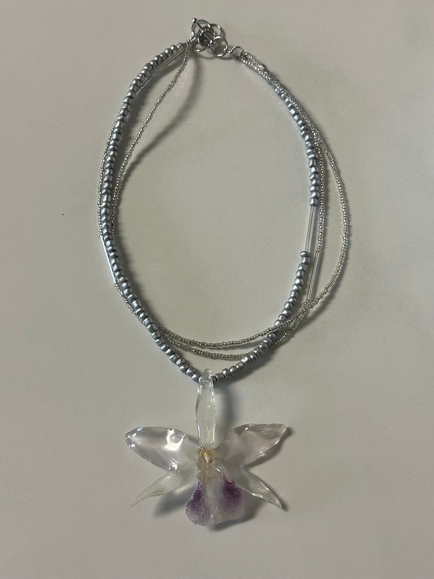 three-strand silver orchid necklace