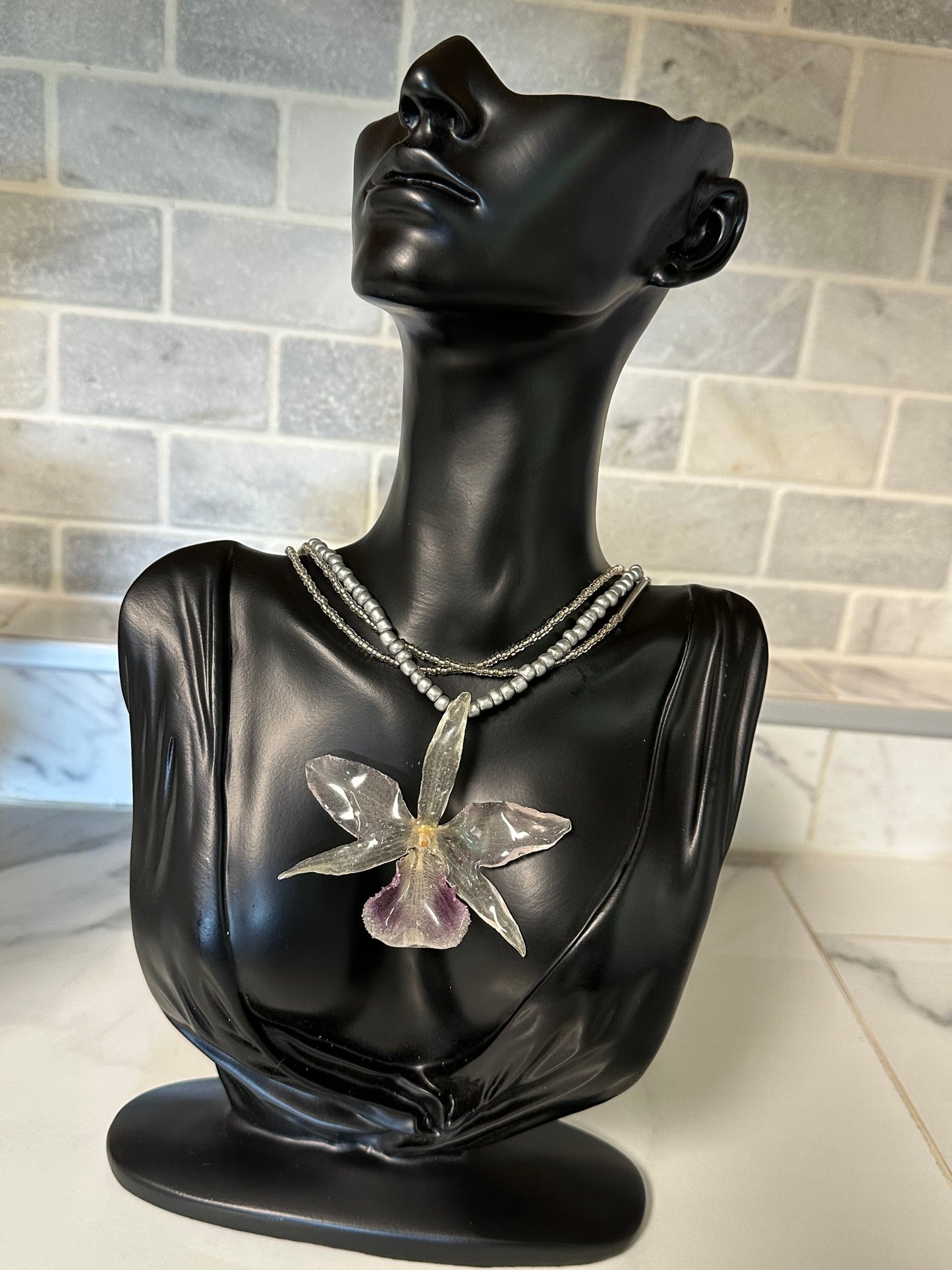three-strand silver orchid necklace