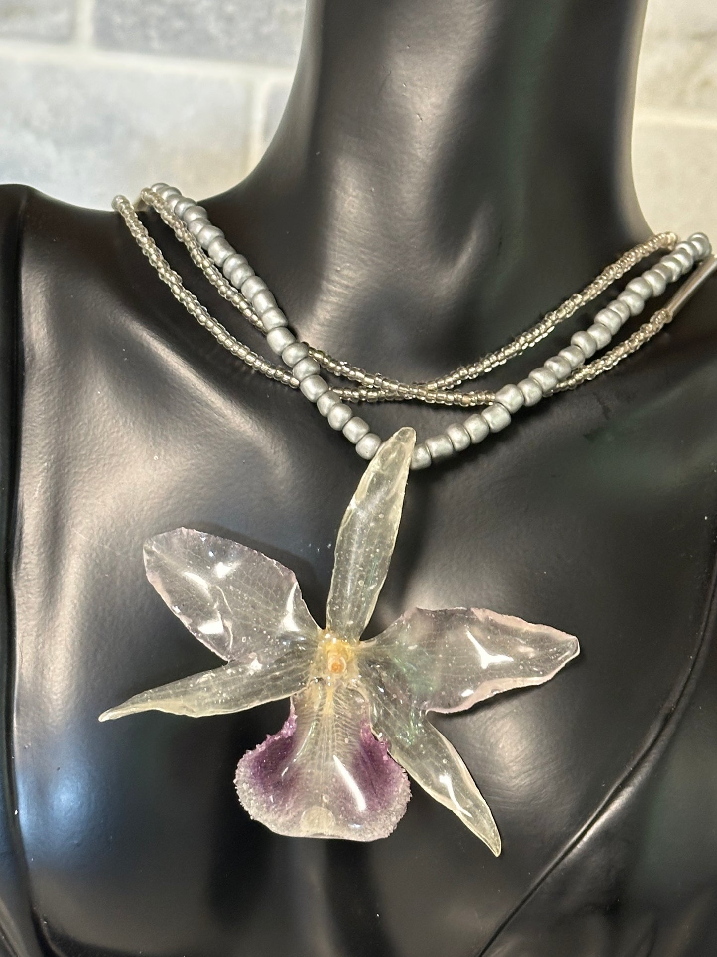 three-strand silver orchid necklace