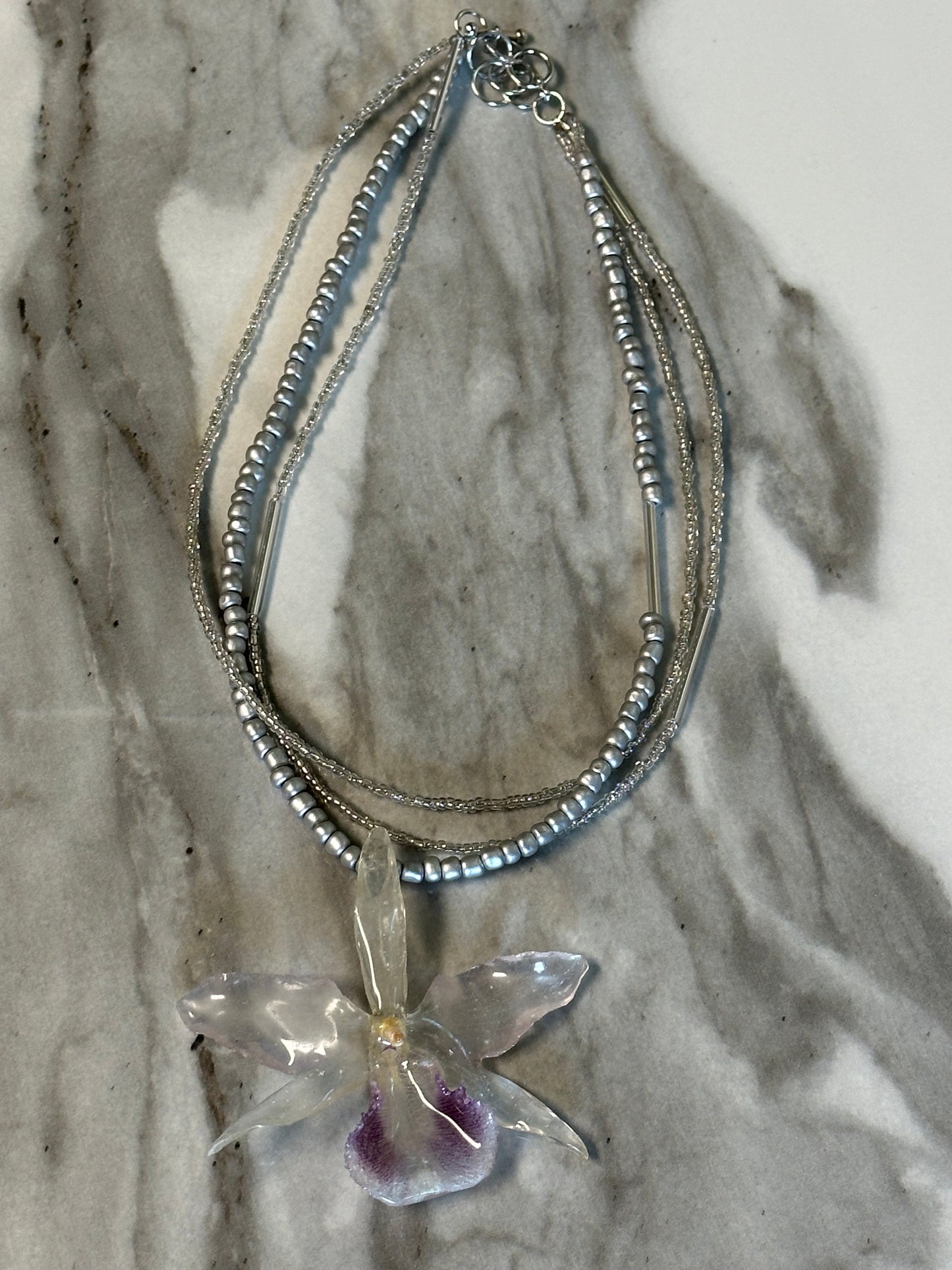 three-strand silver orchid necklace